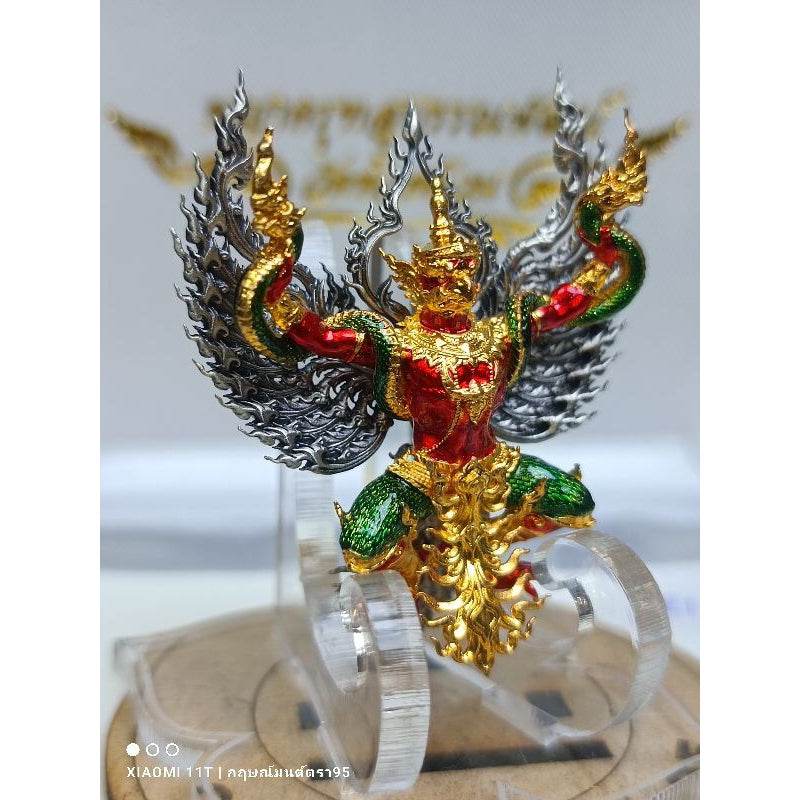 Blessed Thai talisman for wealth featuring a colorful Garuda figure with gold, red, and green details