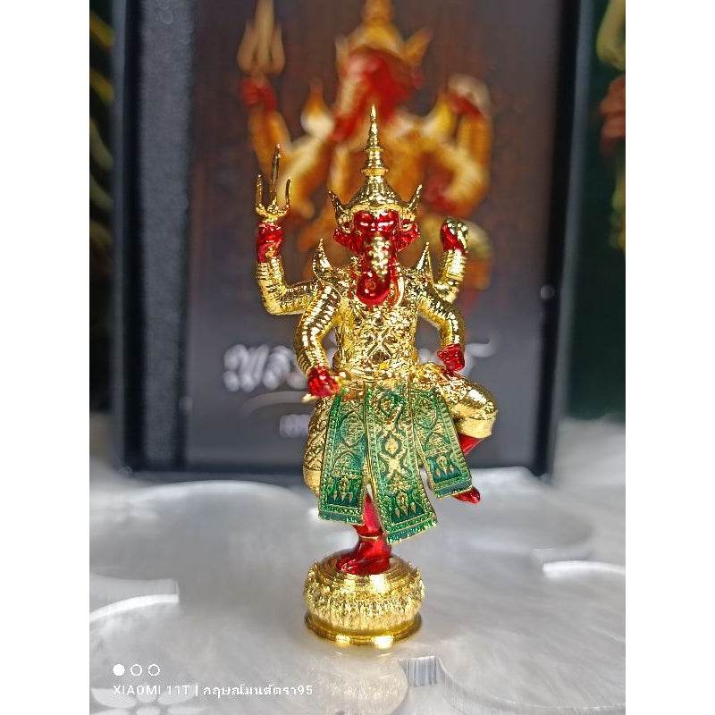 Bronze Ganesha statue blessed in temples with intricate gold and green detailing from Thai Blessing Co