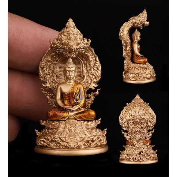 Buddhist protection amulet Thailand featuring intricately designed Buddha statue with vibrant colors and fine details