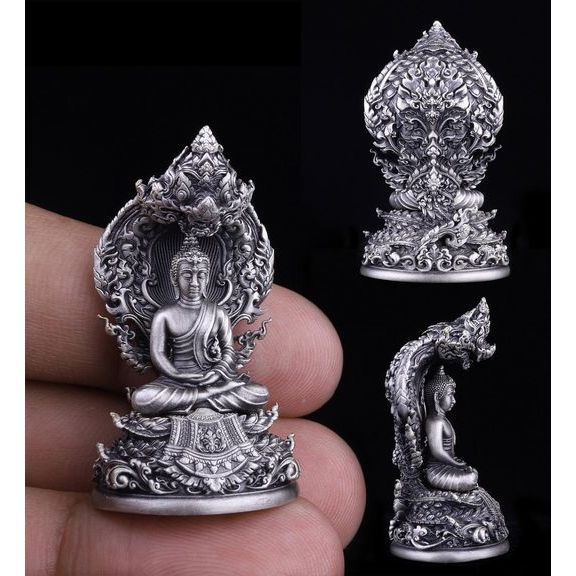 Intricate silver Buddha statue as a Buddhist protection amulet Thailand for spiritual and decorative use
