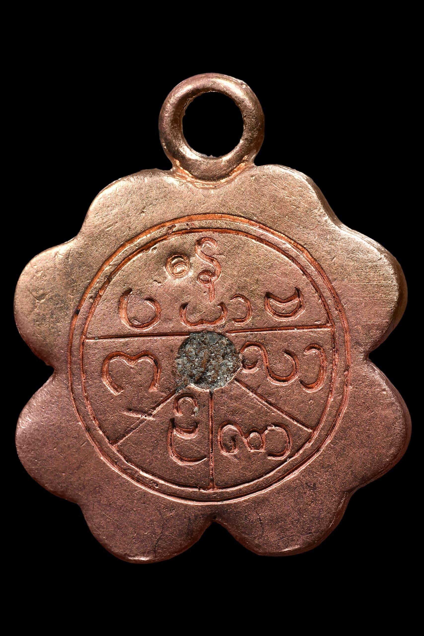 Celestial Flower of Divine Fortune amulet in a floral shape with intricate detailed engravings