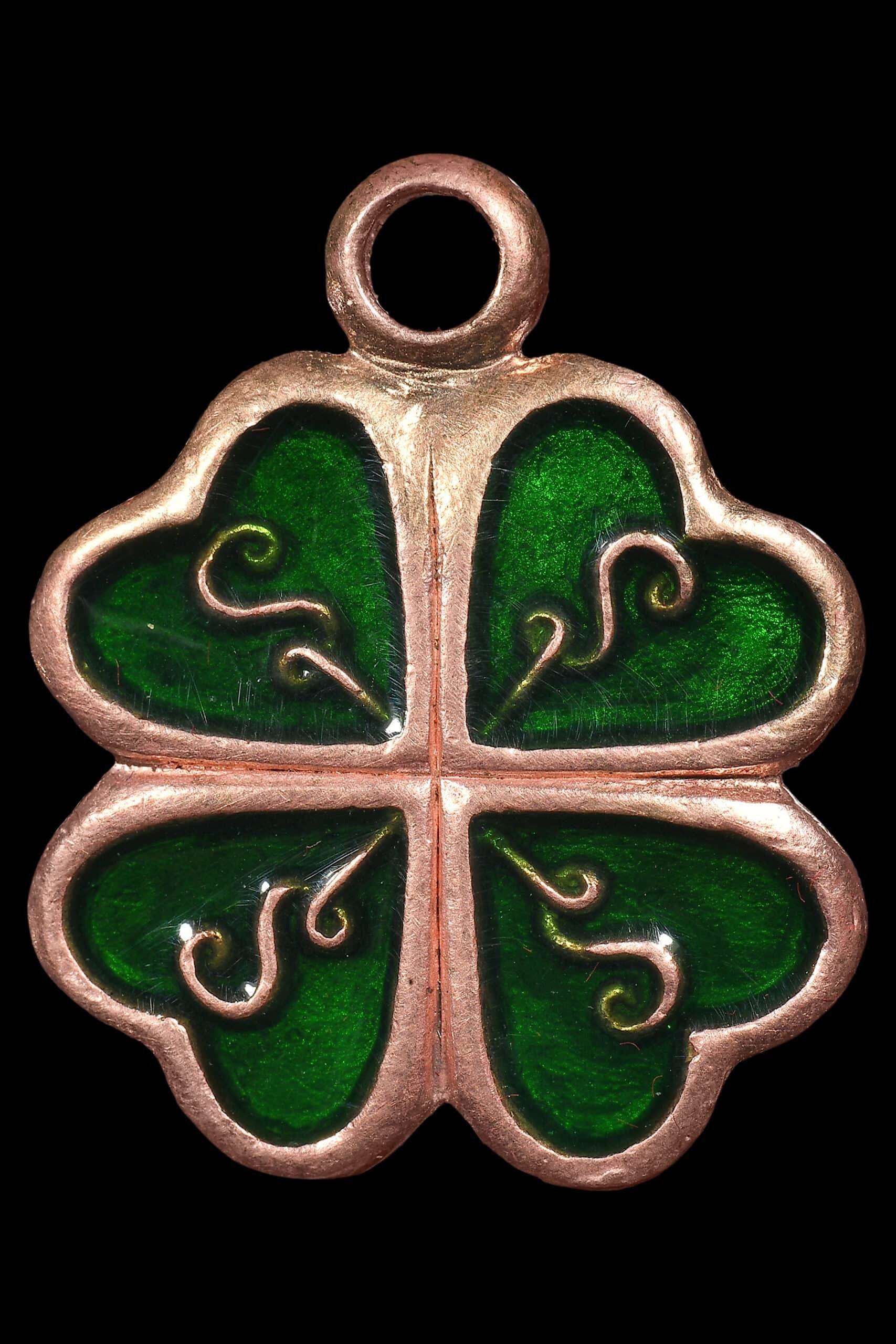 Celestial Flower of Divine Fortune amulet in green with intricate designs representing luck and prosperity.