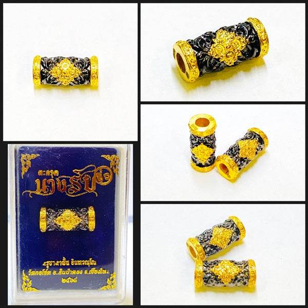 Thai talisman charm and attraction in gold and black design for spiritual decoration
