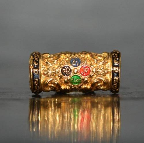 Gold Thai talisman featuring colorful gemstones for charm and attraction Thai talisman decoration