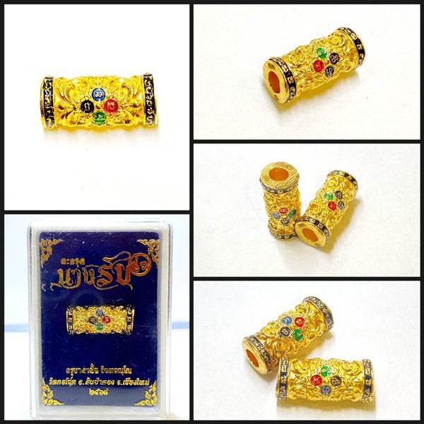 Golden charm and attraction Thai talisman with colorful gems for spiritual benefits and decor