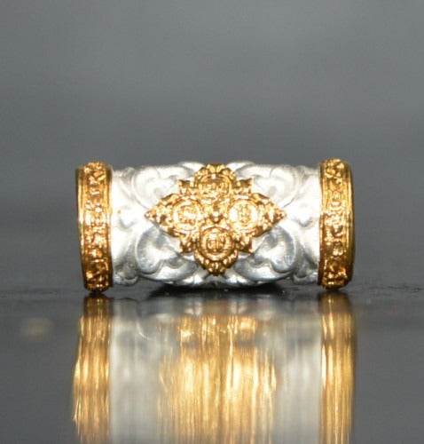 Elegant silver and gold charm and attraction Thai talisman with intricate design for spiritual decor