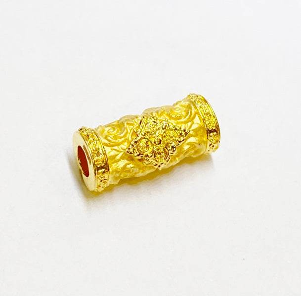 Golden charm and attraction Thai talisman featuring intricate designs for spiritual and decorative use