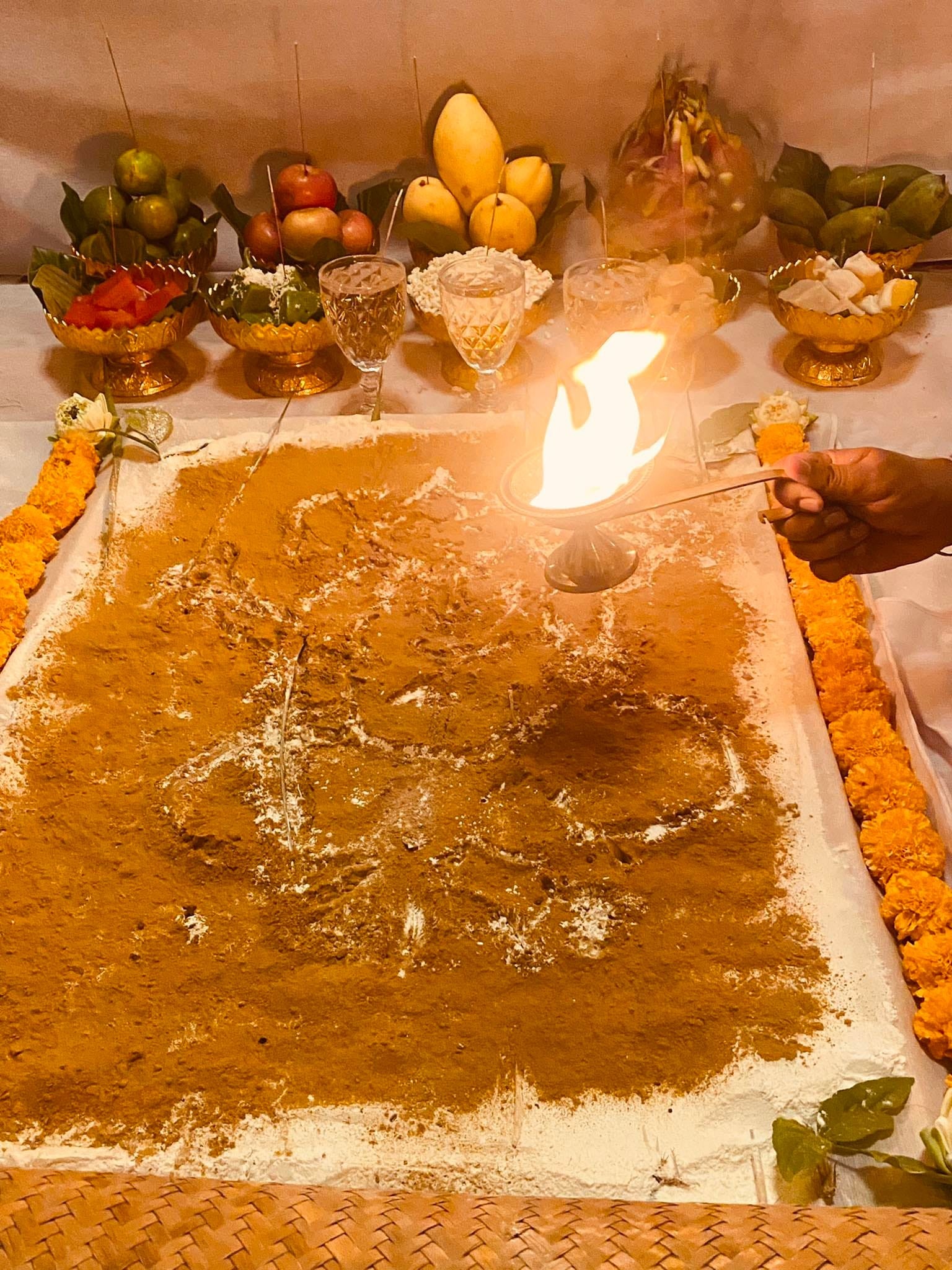 Ceremonial setup featuring herbs and fruits for a Thai ritual to cleanse negative energy Thai amulet