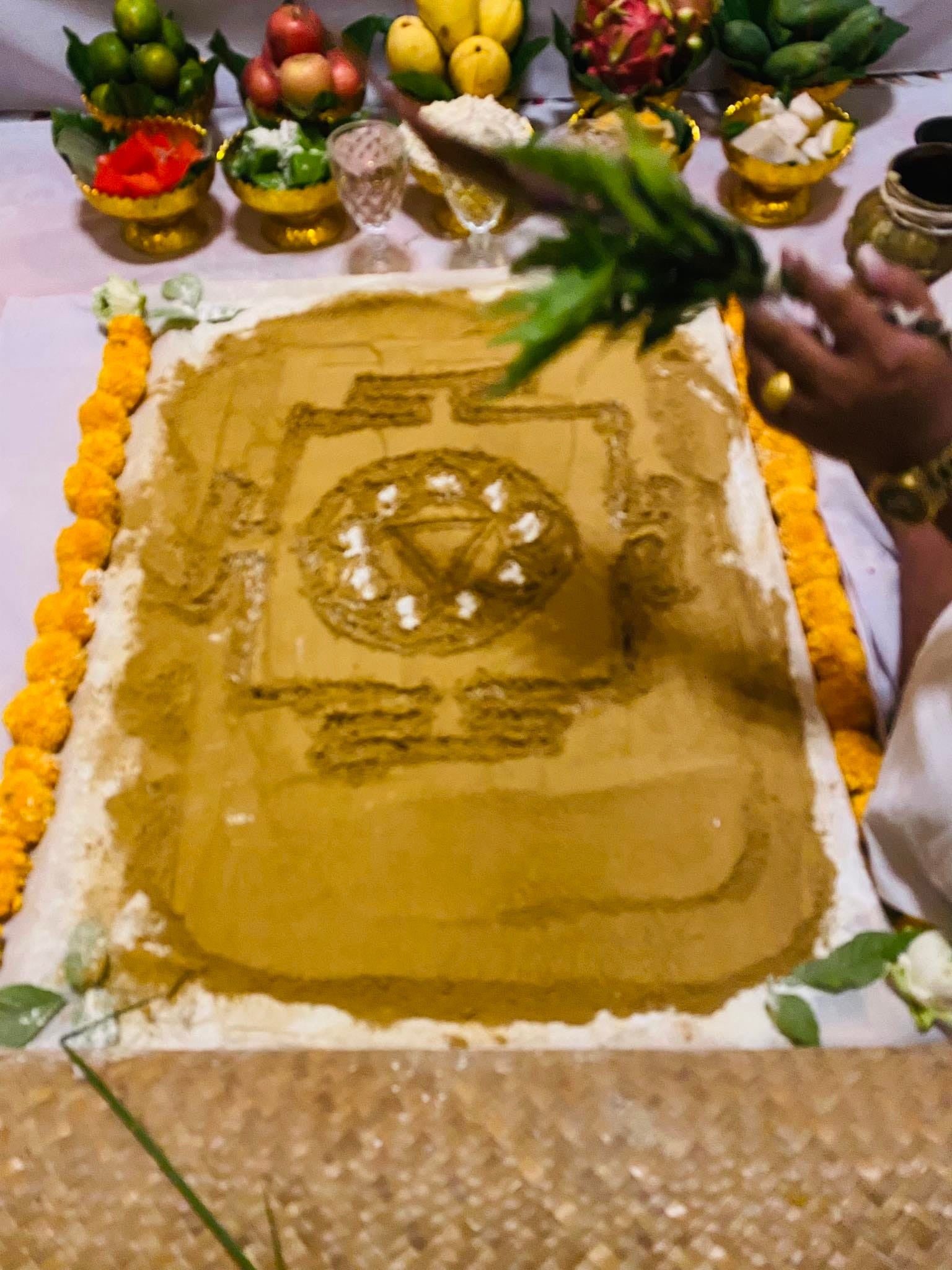 Ritual setup with offerings for a cleanse negative energy Thai amulet ceremony featuring symbolic designs