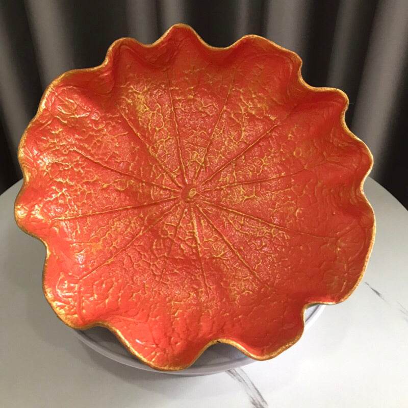 Decorative natural resin bowl 20cm in bright orange with textured leaf design and wavy edges