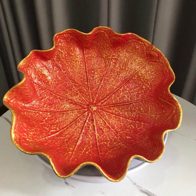 Decorative natural resin bowl 20cm with red and gold leaf design on a white surface