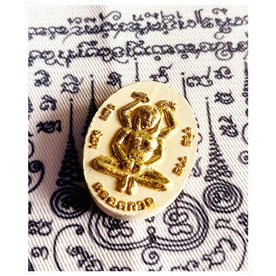 Divine attraction Thai charm featuring a sacred deity design for good fortune and prosperity