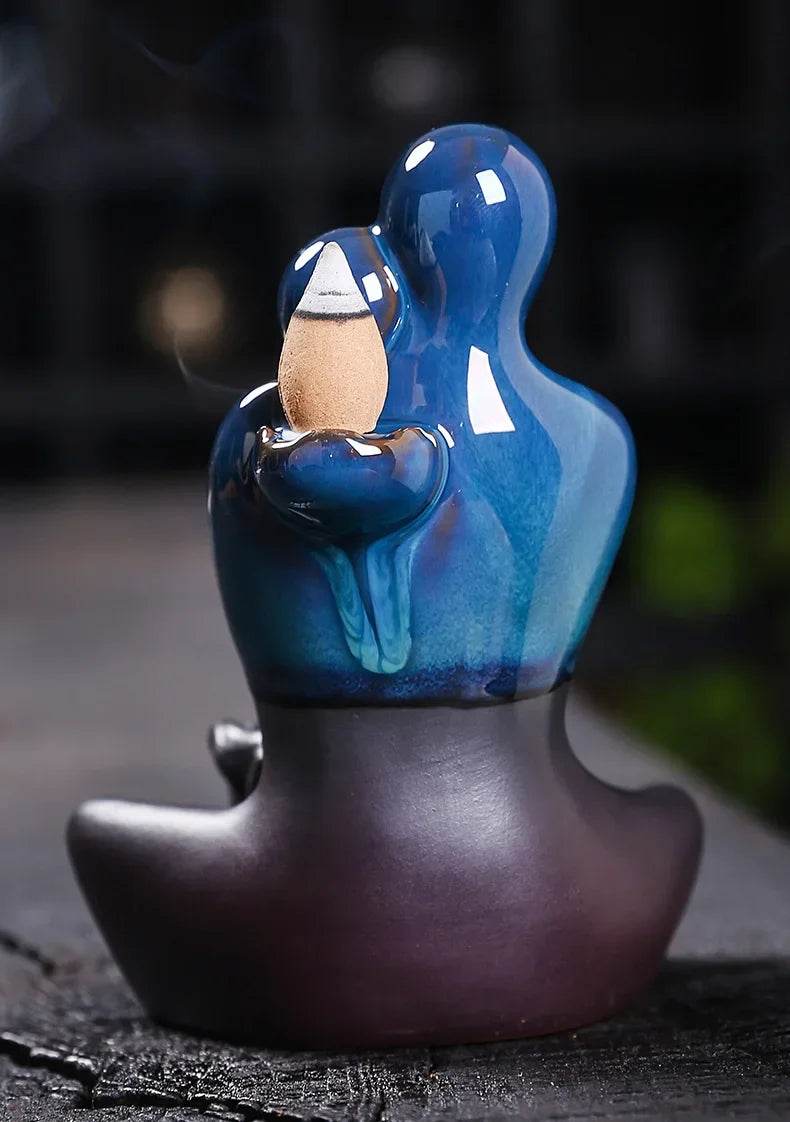 Thai Blessing Co ceramic backflow incense burner blue glazed figure holding cone with cascading smoke