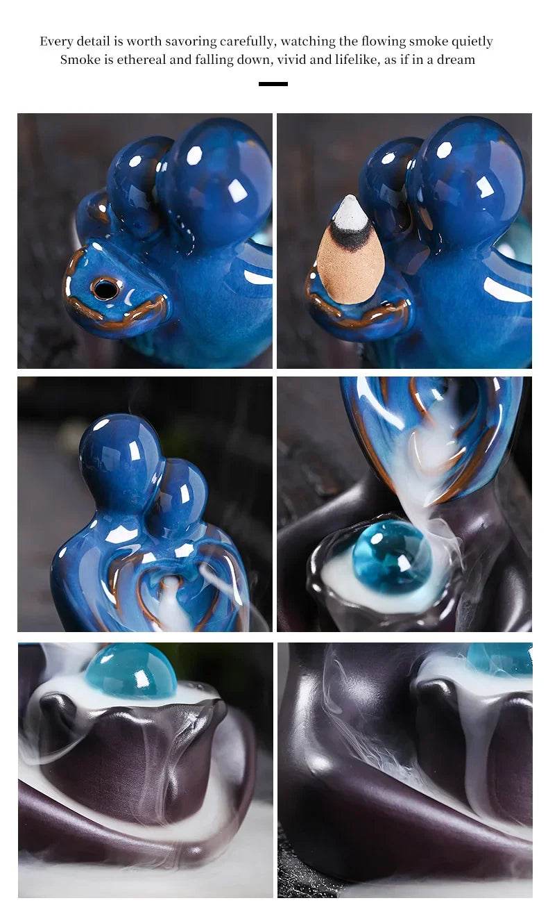 Blue glossy ceramic backflow incense burner in abstract elephant form with cascading white smoke over glossy base