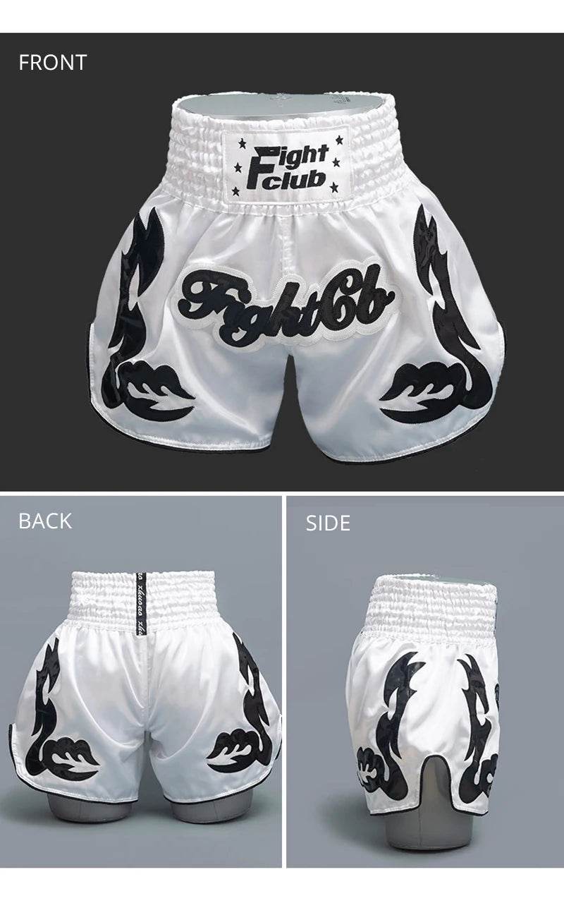 White Muay Thai shorts Thailand with black tribal flame design shown front back and side views elastic waistband