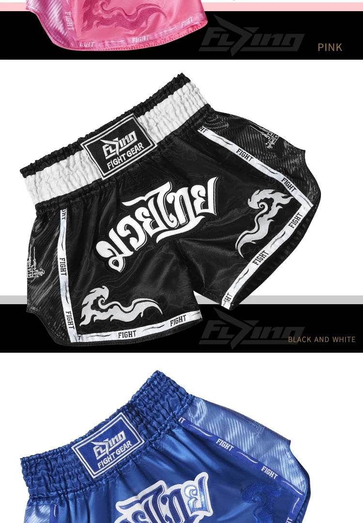 Black and white Muay Thai boxing shorts with elastic waistband Thai script and flame graphics