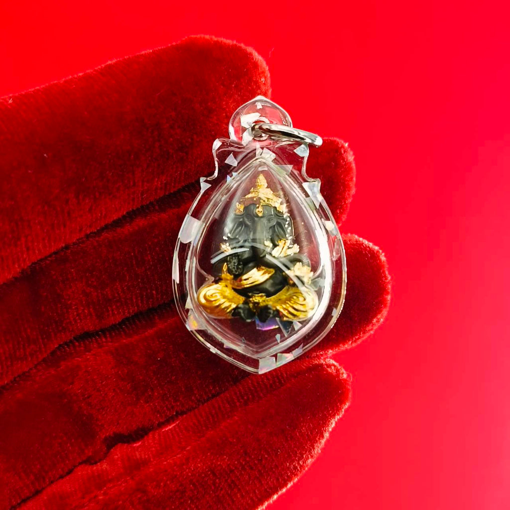 Clear Ganesh amulet for luck and success featuring intricate details and a decorative design