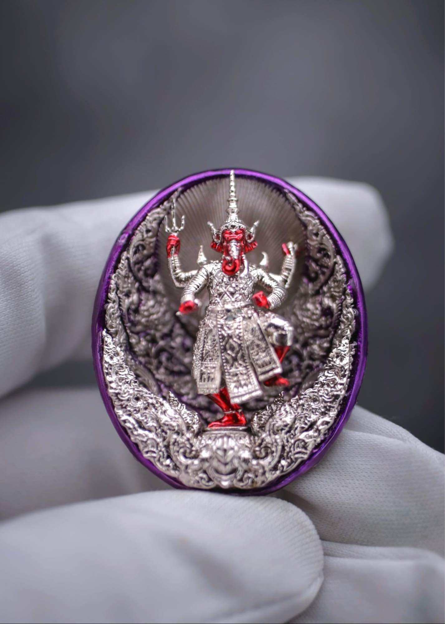 Ganesh coin amulet for wealth featuring a detailed statue of Ganesh in vibrant colors