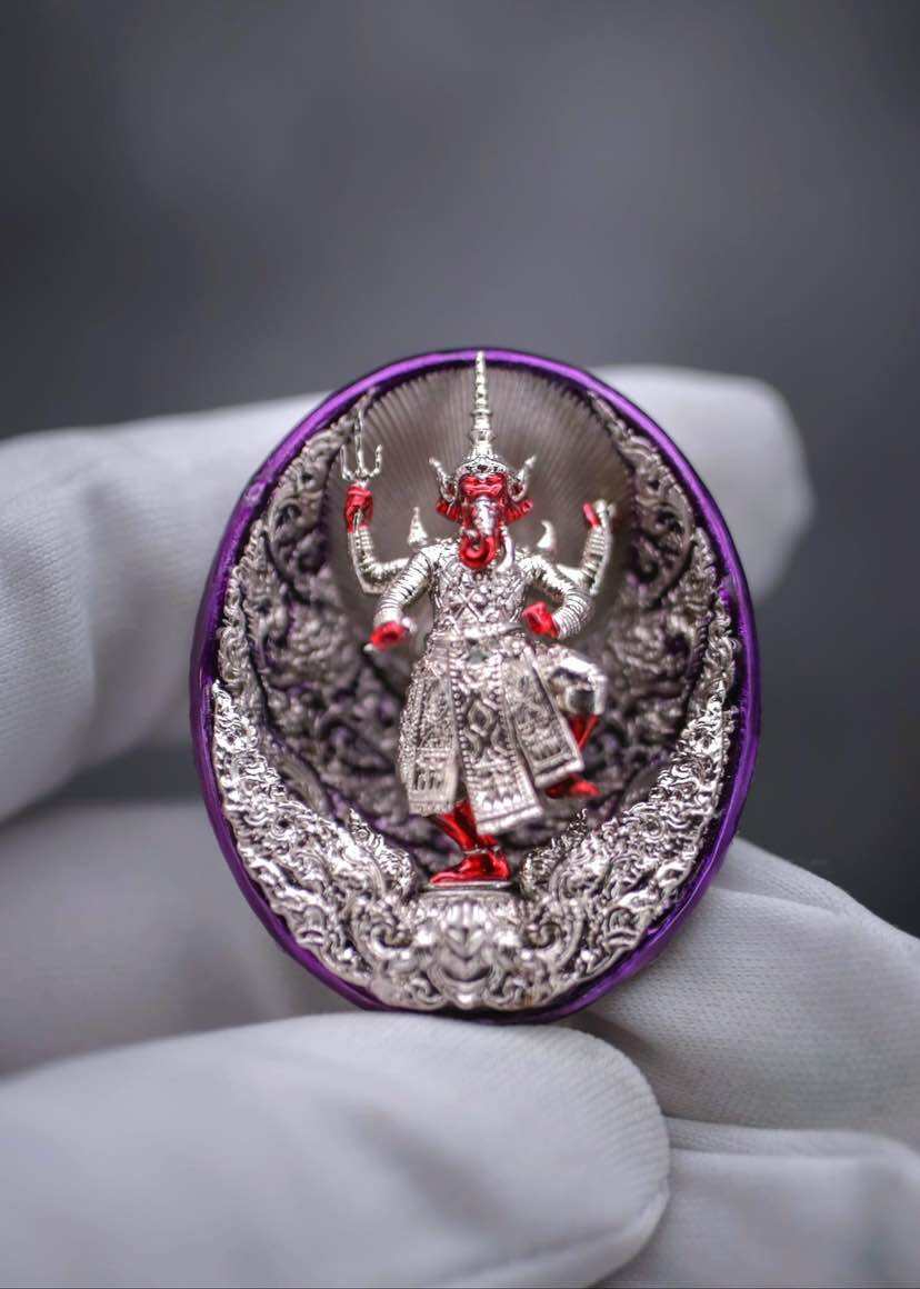 Ganesh coin amulet for wealth featuring a detailed statue in a decorative design