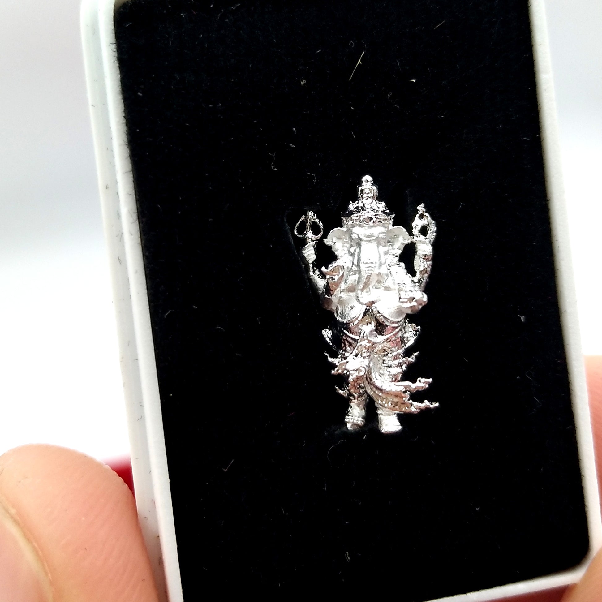 Ganesha amulet for success in detailed silver finish, perfect for home decoration and spiritual blessings