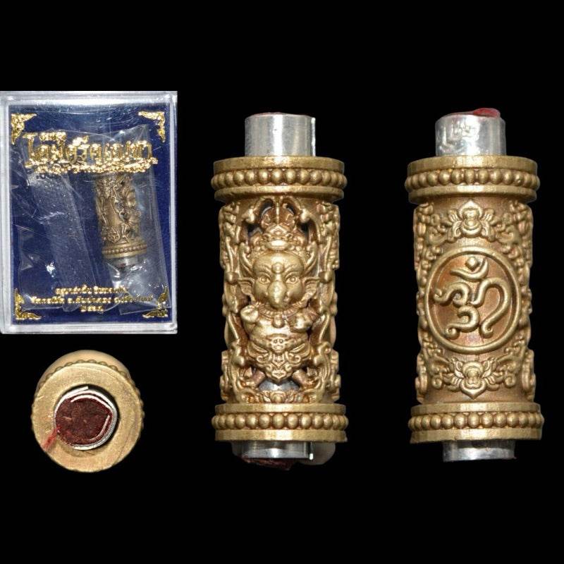 Ganesha Takrut amulet Thailand in gold intricate design with protective symbols and presentation box