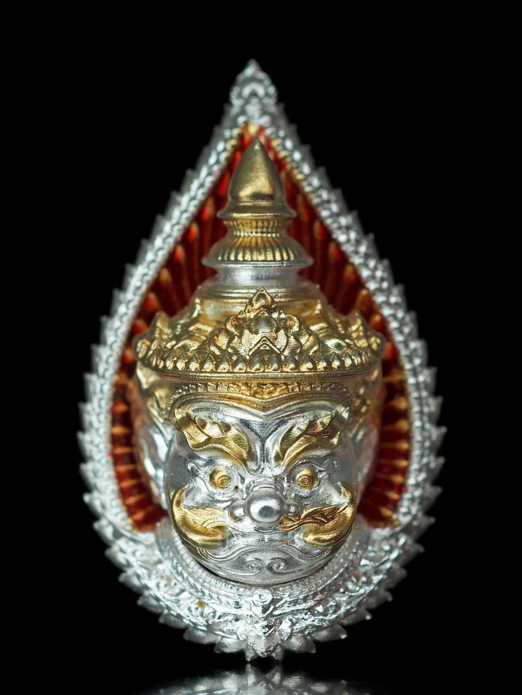 Ornate giant guardian amulet gift set with gold and silver detailing on black background