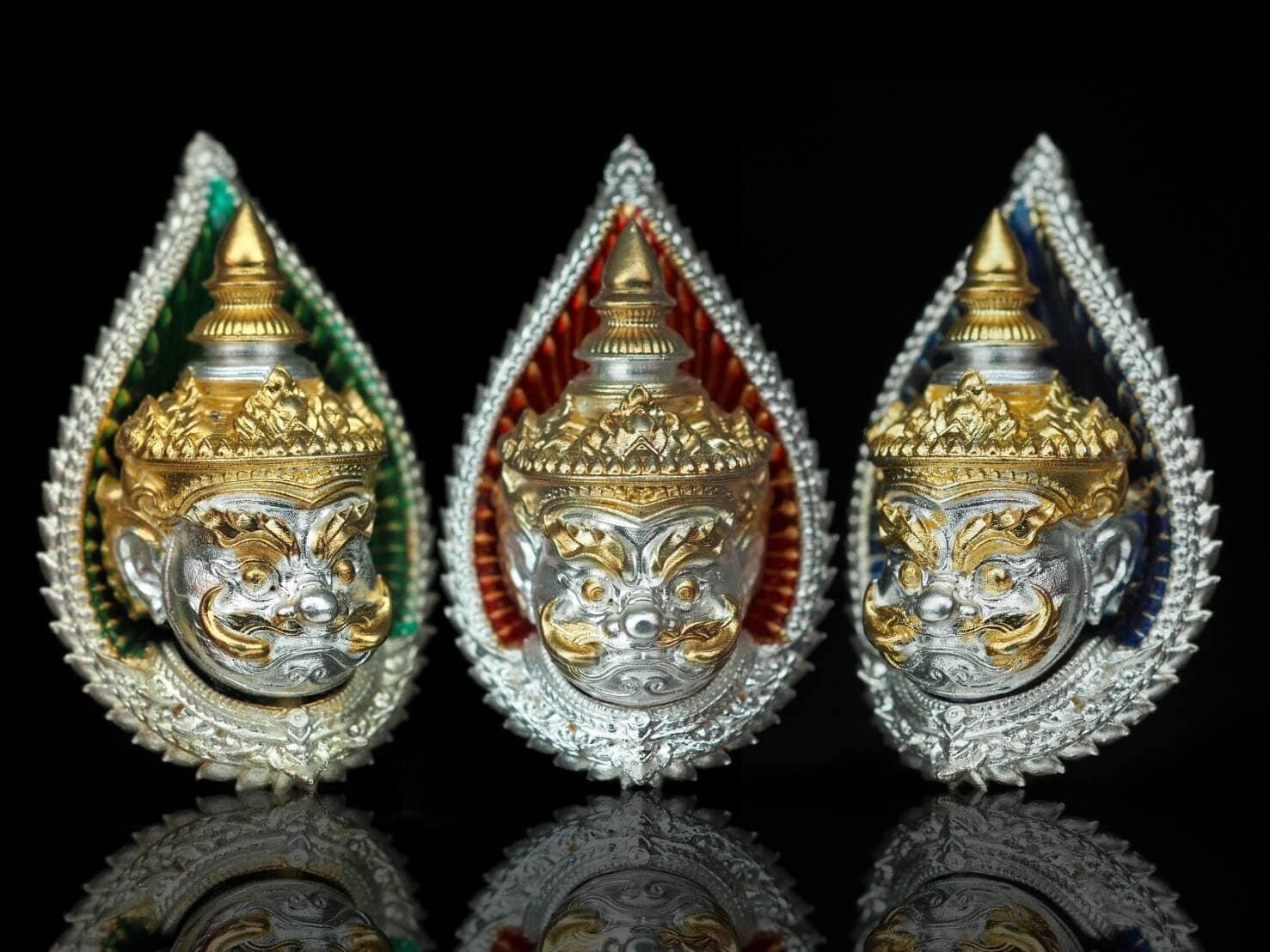 Giant guardian amulet gift set featuring three detailed silver and gold guardian faces with colorful backgrounds