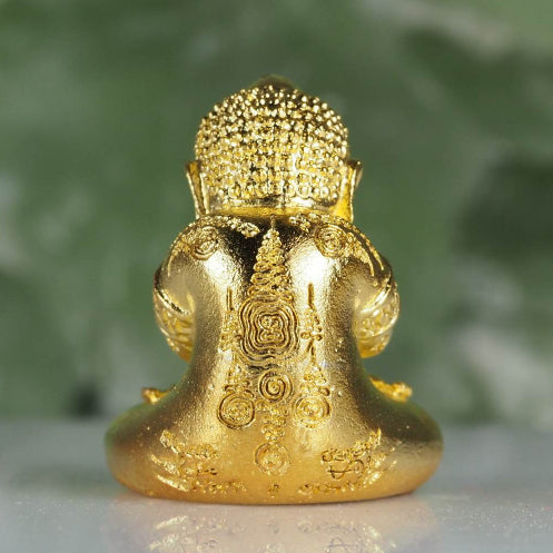 Golden Phra Pidta amulet for wealth with intricate engraved details from Thai Blessing Co