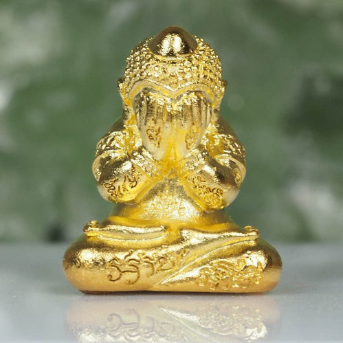 Golden Phra Pidta amulet for wealth with intricate engravings from Thai Blessing Co