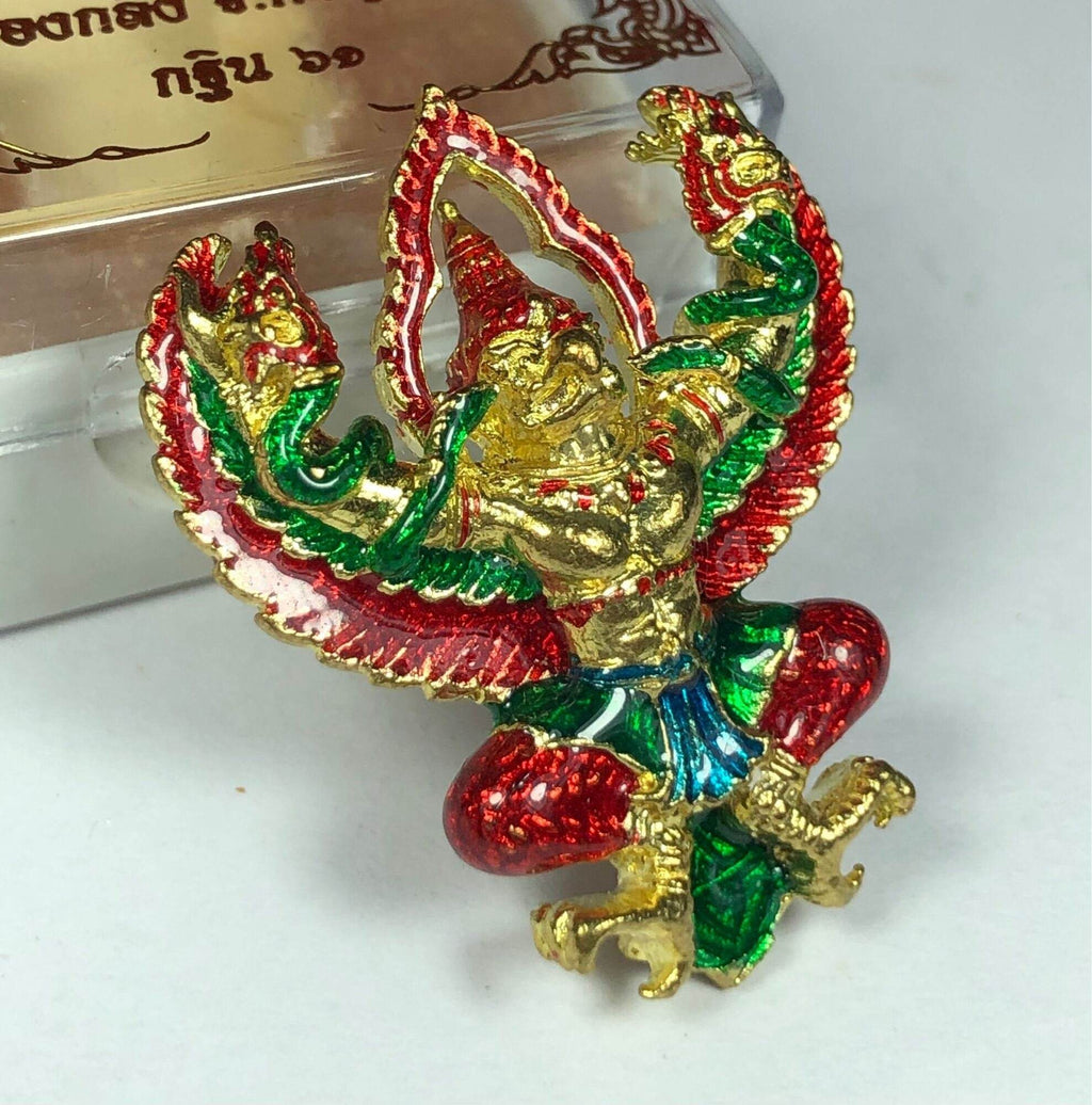 Golden Garuda lucky charm ornament with red and green enamel detailing and intricate design