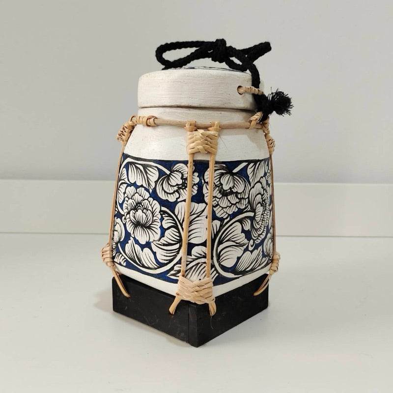 Handcrafted bamboo jewelry box with floral design and black base for home storage