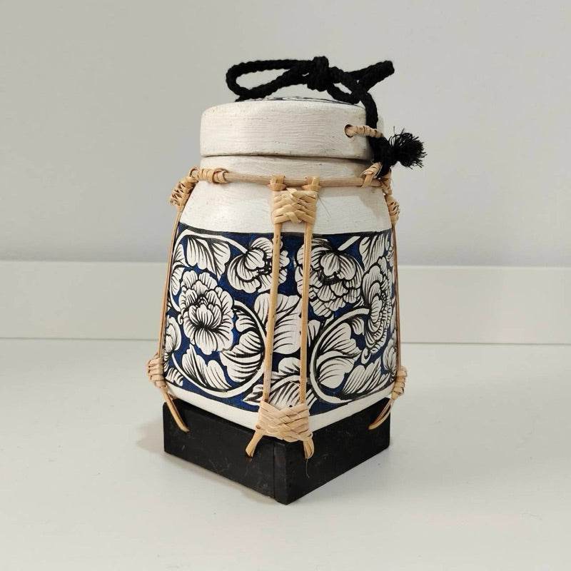 Handcrafted bamboo jewelry box with floral design and black cord closure from One-Sake.com