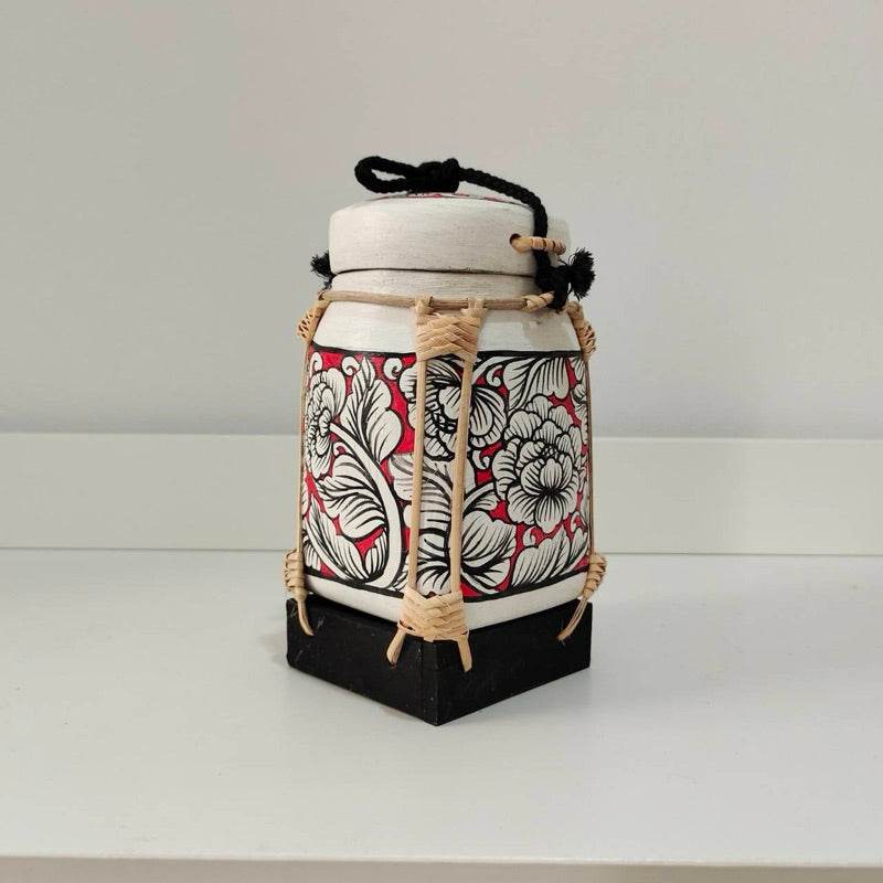 Handcrafted bamboo jewelry box with floral design and black base for elegant storage