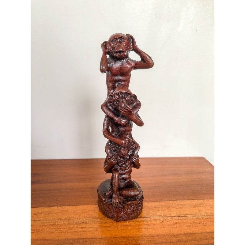 Wooden carved statue of three monkeys in hear no evil see no evil speak no evil pose buddhist mindfulness home decor