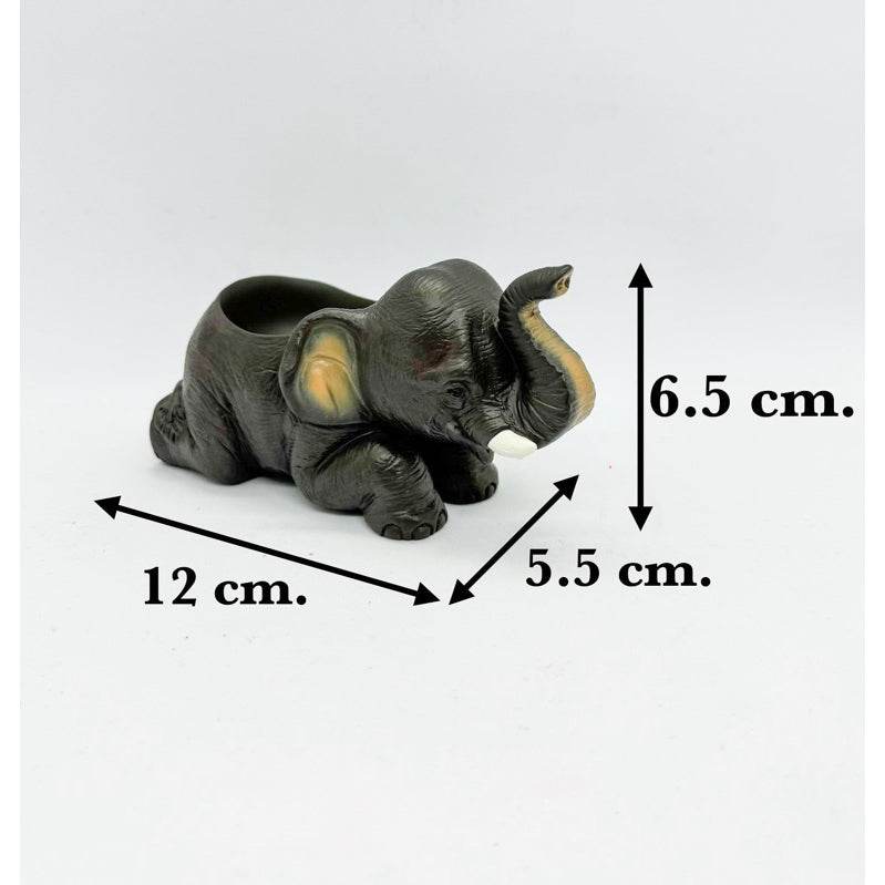 Handcrafted resin elephant decor in black with detailed features and size dimensions
