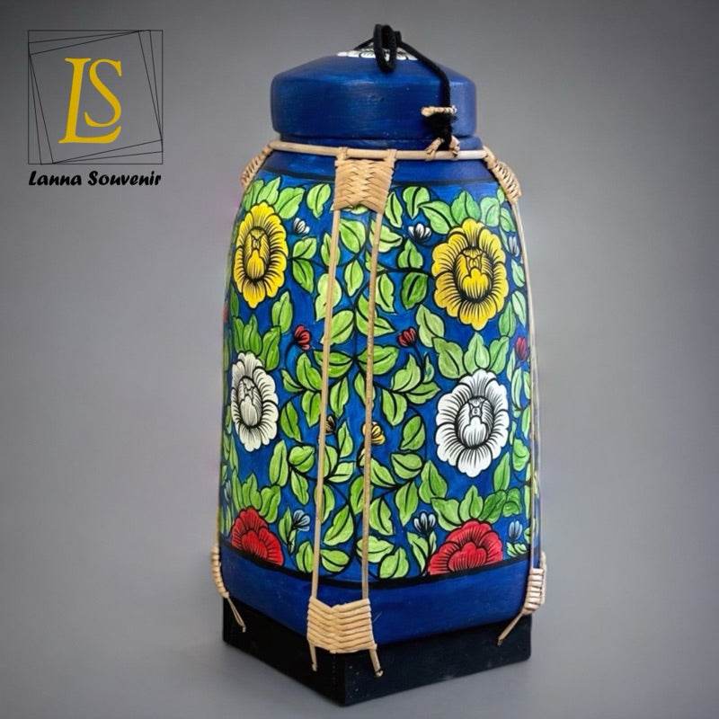 Handmade Thai bamboo rice basket with colorful floral design and blue accents from One-Sake.com