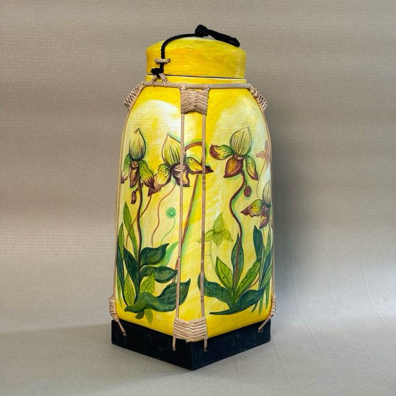 Handmade Thai bamboo rice basket with yellow floral design and black base from One-Sake.com