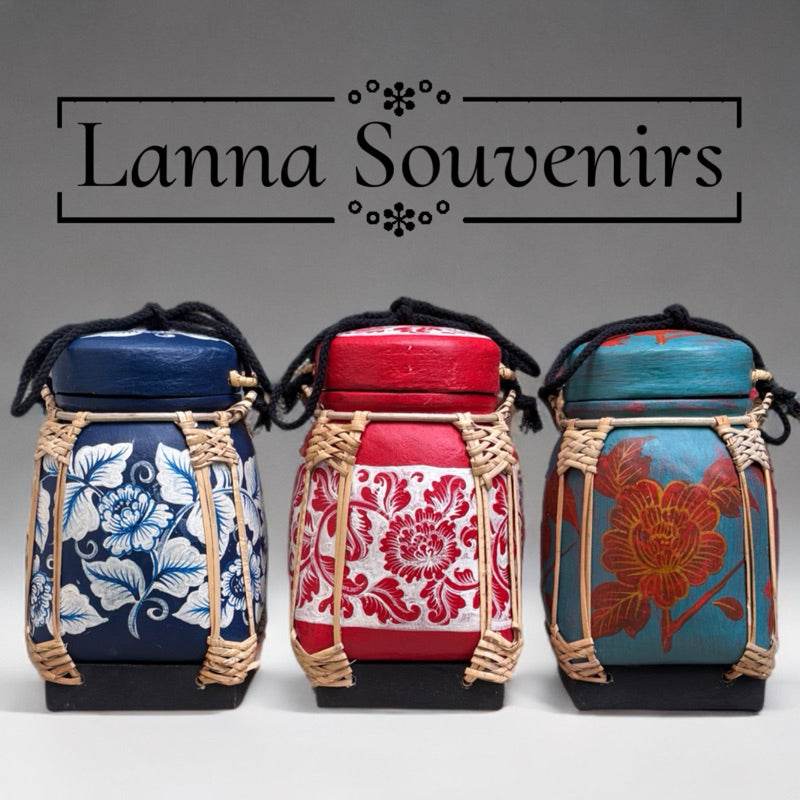 Handmade Thai bamboo rice box in blue red and teal with floral designs and woven details