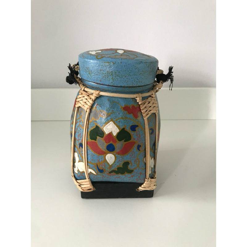 Handmade Thai bamboo rice box with blue floral design and woven details from One-Sake.com