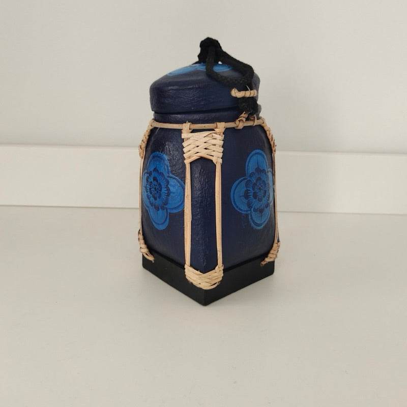 Handmade Thai bamboo rice box with blue floral design and natural woven details from One-Sake.com