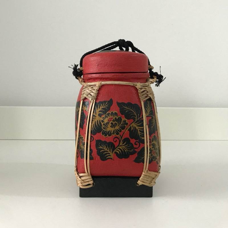 Handmade Thai bamboo rice box with red and black floral design by One-Sake.com