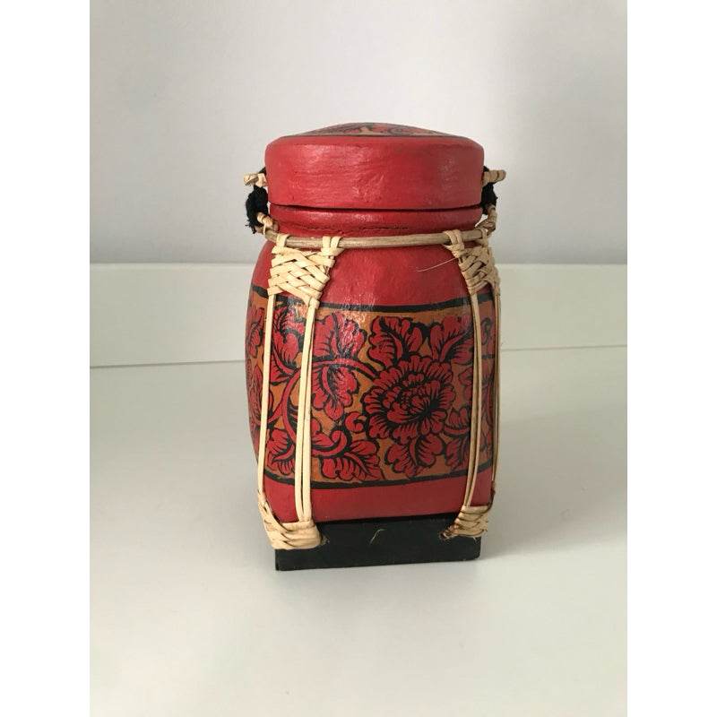 Handmade Thai bamboo rice box with red floral design and natural woven accents by One-Sake.com
