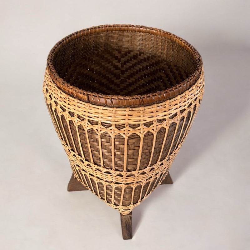 Handwoven bamboo rattan basket with wooden stand for stylish home storage and organization