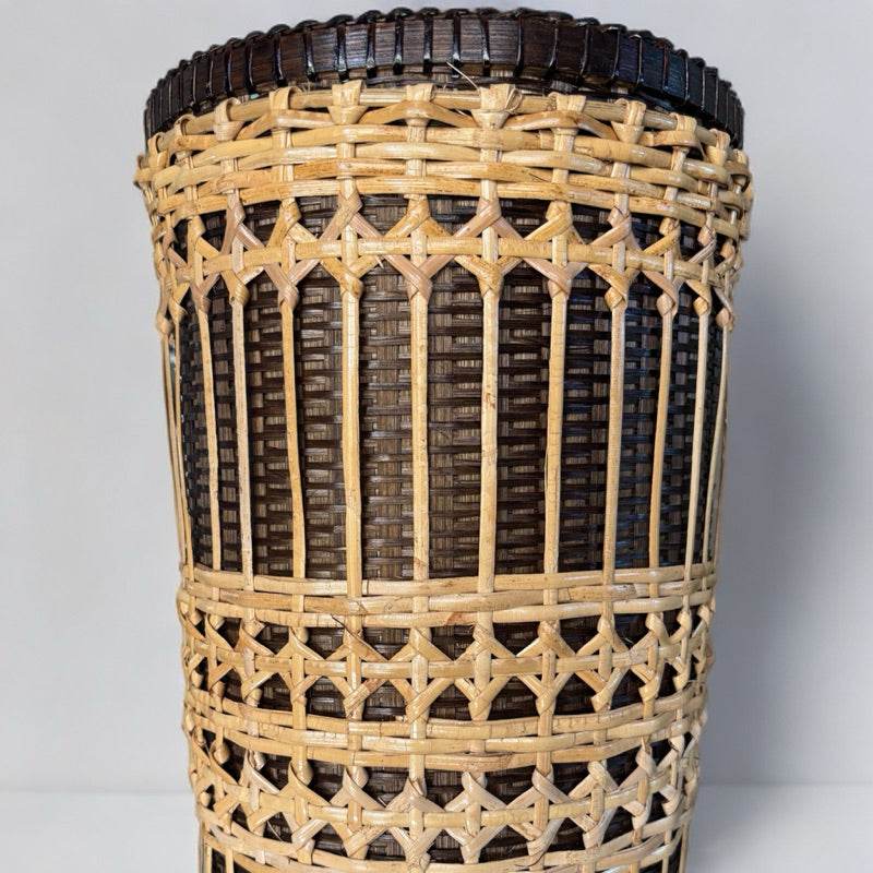 Handwoven bamboo rattan basket with natural light and dark brown woven patterns for home storage