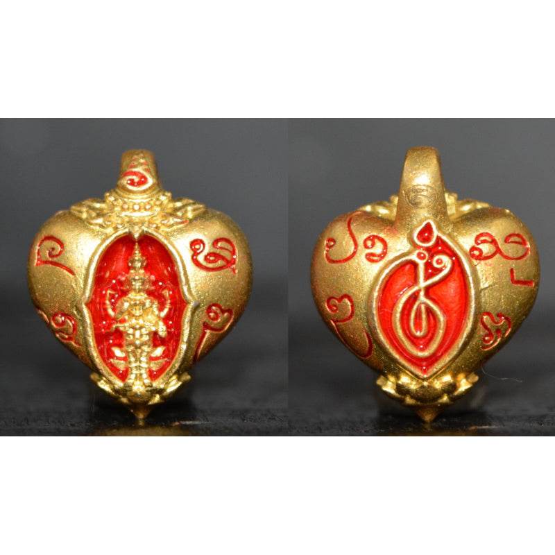 Heart of Trimurti love amulet in gold with intricate designs and red accents for spiritual significance