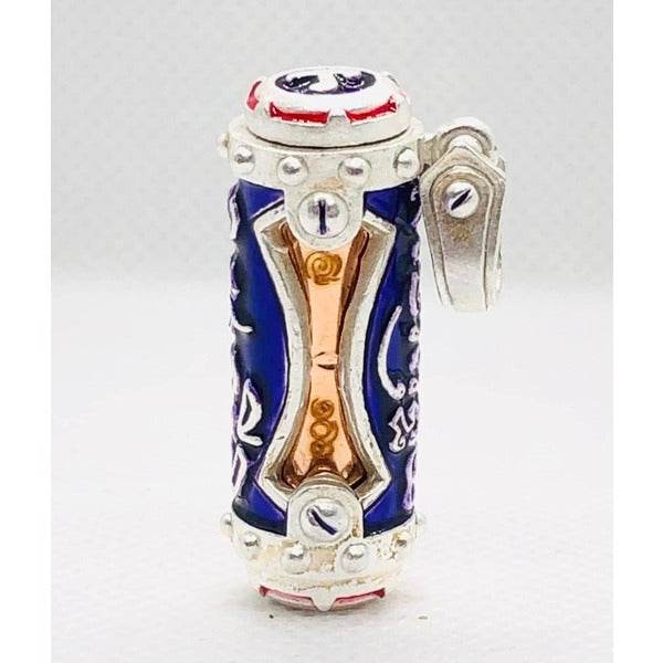 Jindamanee Takrut Thai amulet for wealth featuring intricate designs and a silver casing