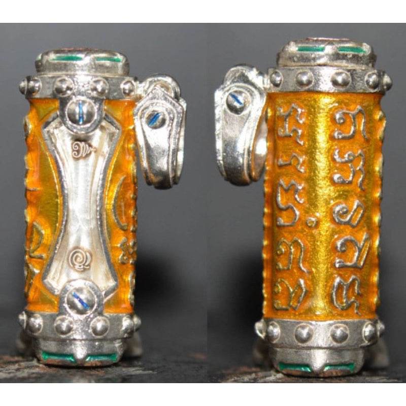 Jindamanee Takrut Thai amulet for wealth featuring intricate designs and vibrant colors on a metal casing