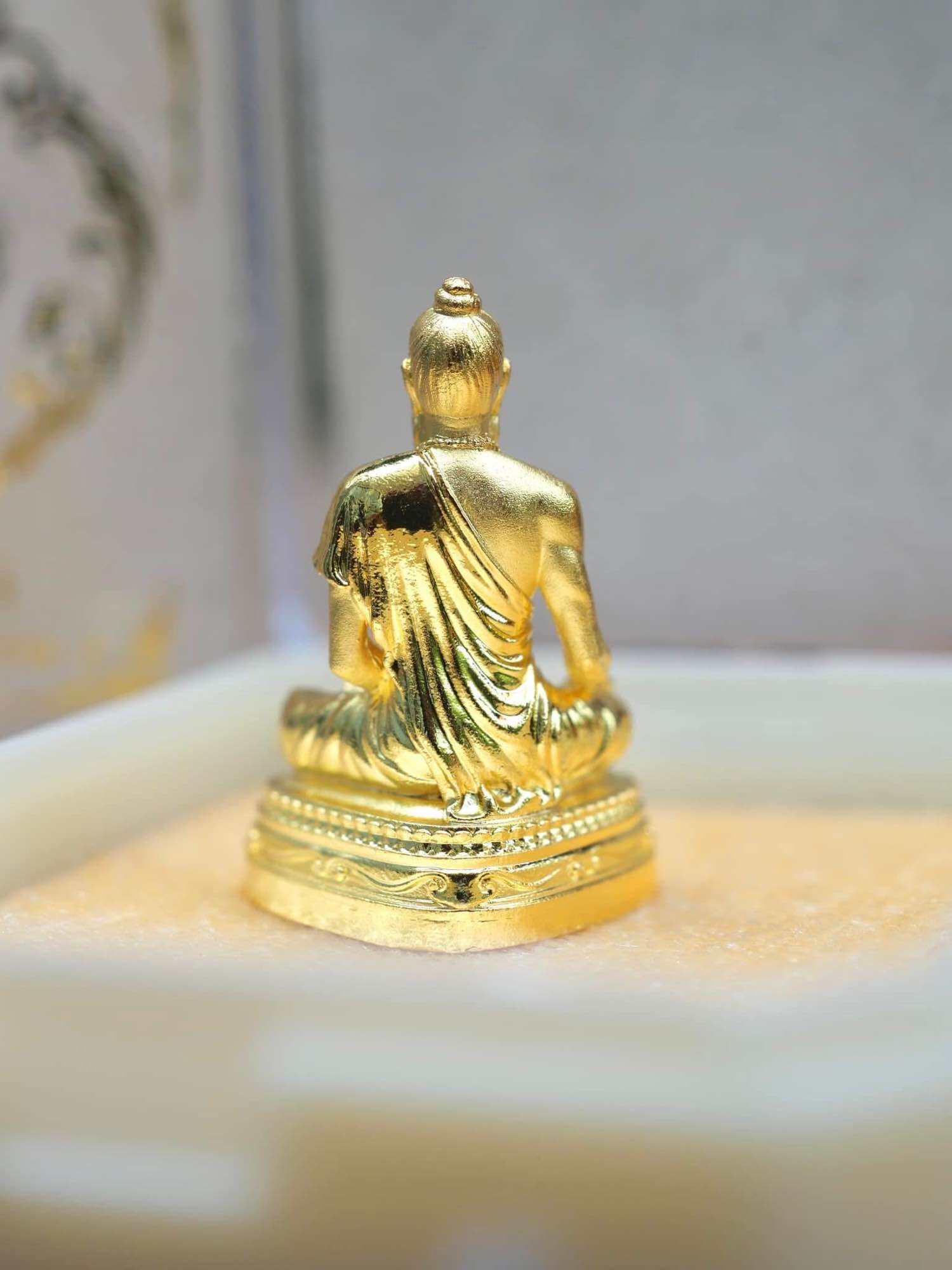 Jivaka Komarabhacca amulet for health in gold finish displayed in a decorative box