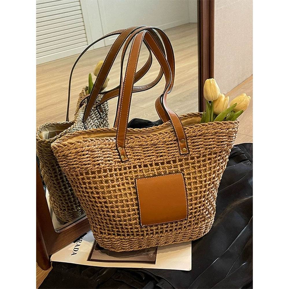 Korean style handwoven basket bag with brown leather handles and pocket, filled with yellow tulips