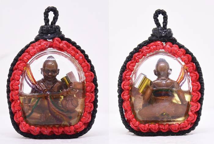 Kuman Chao Sua Noi rich guardian talisman in a protective casing with a detailed figure and vibrant colors